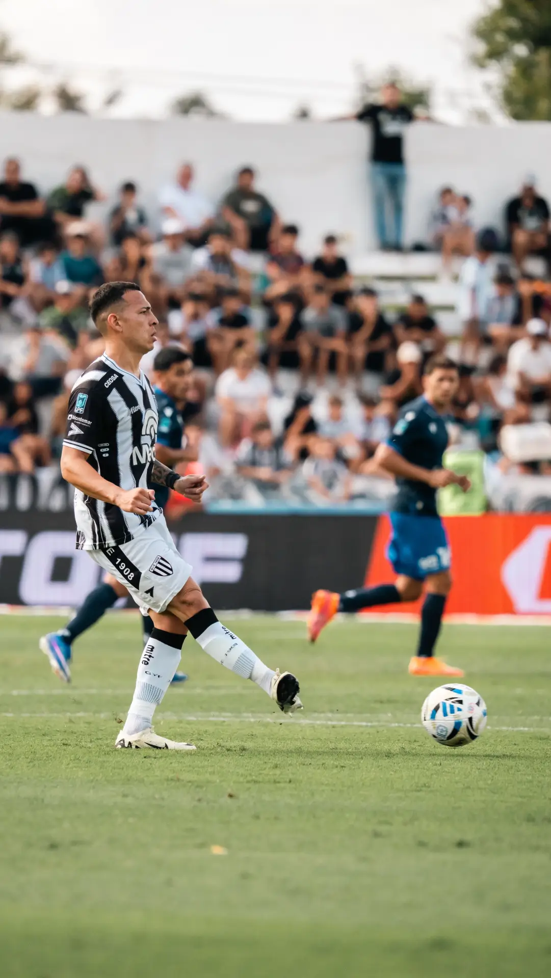 Dynamic scene of players during a competitive soccer match